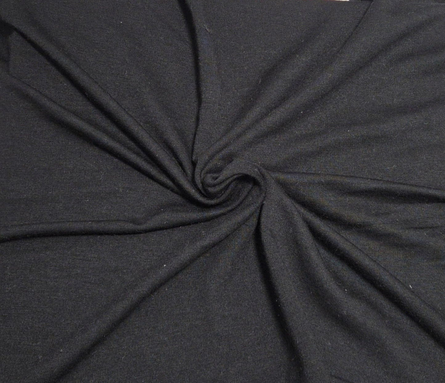 black tencel spandex sweatshirt fleece knit fabric by yard and wholesale in los angeles for cozy hoodies, sweatshirts, zip ups, joggers, kids apparel, and dog clothes