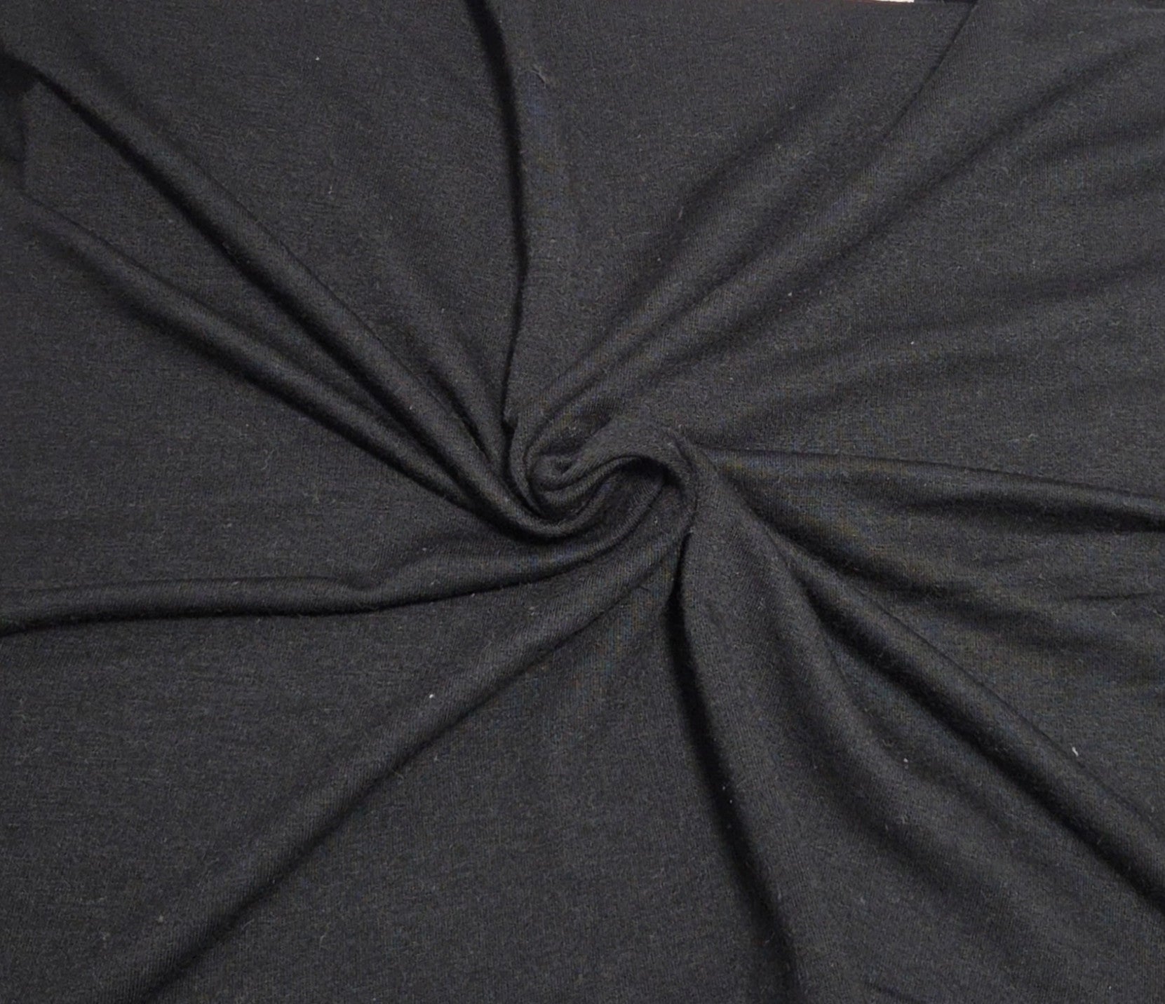 black tencel spandex sweatshirt fleece knit fabric by yard and wholesale in los angeles for cozy hoodies, sweatshirts, zip ups, joggers, kids apparel, and dog clothes