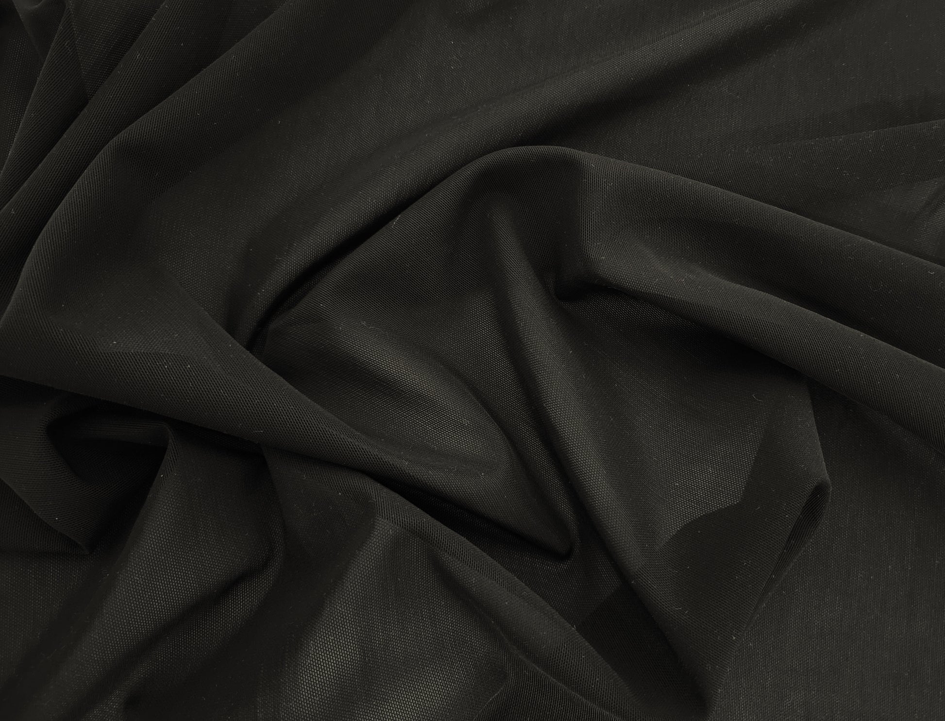 Close-up of black fabric with folds